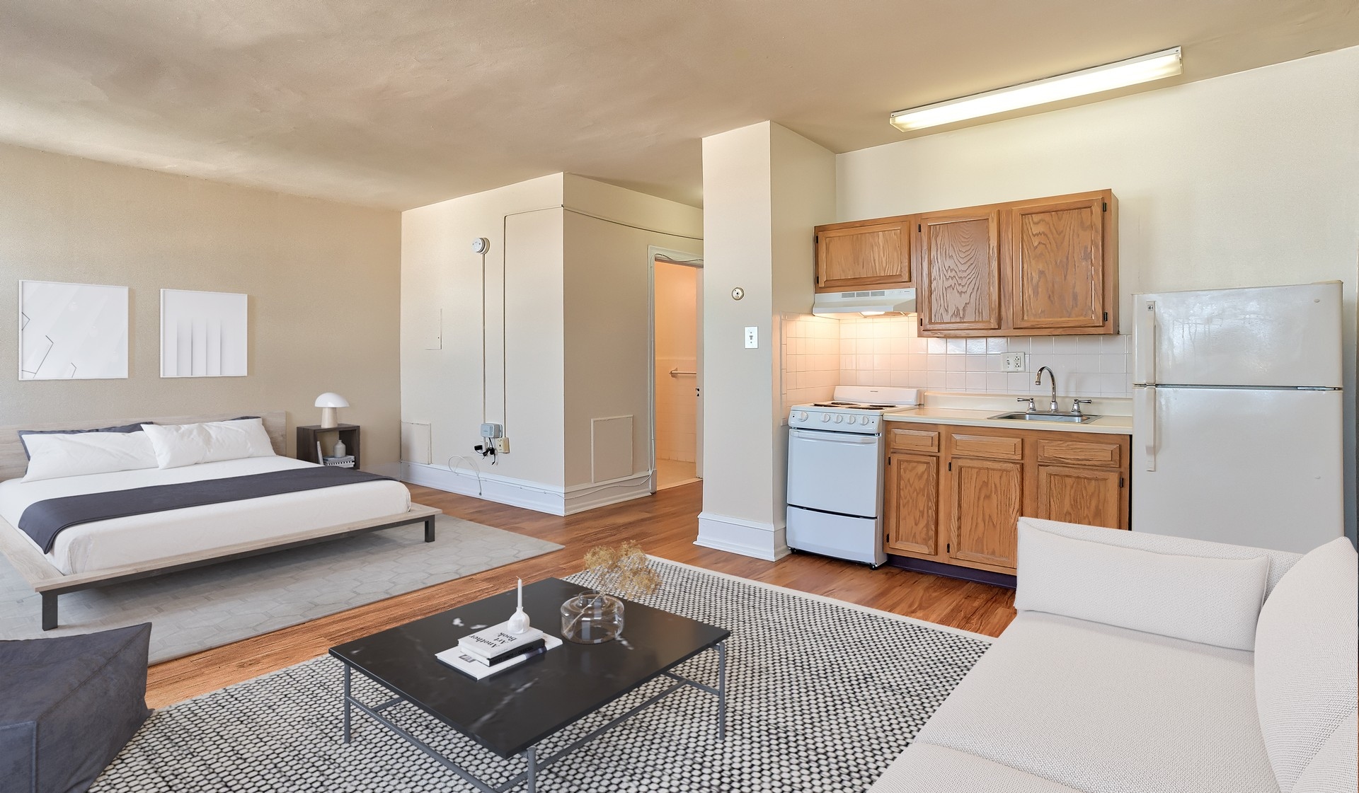 Spacious studio with wood flooring throughout